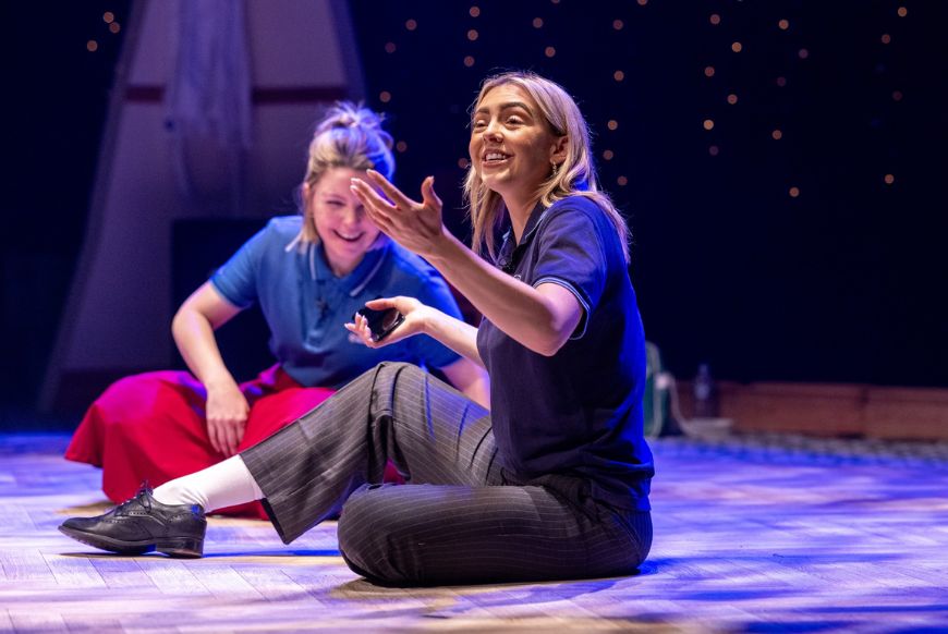 two women on a stage